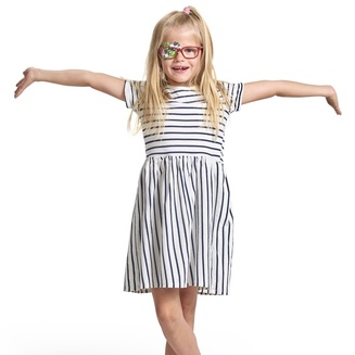 Girl with ORTOPAD® "Panda" eye patch stretching out arms