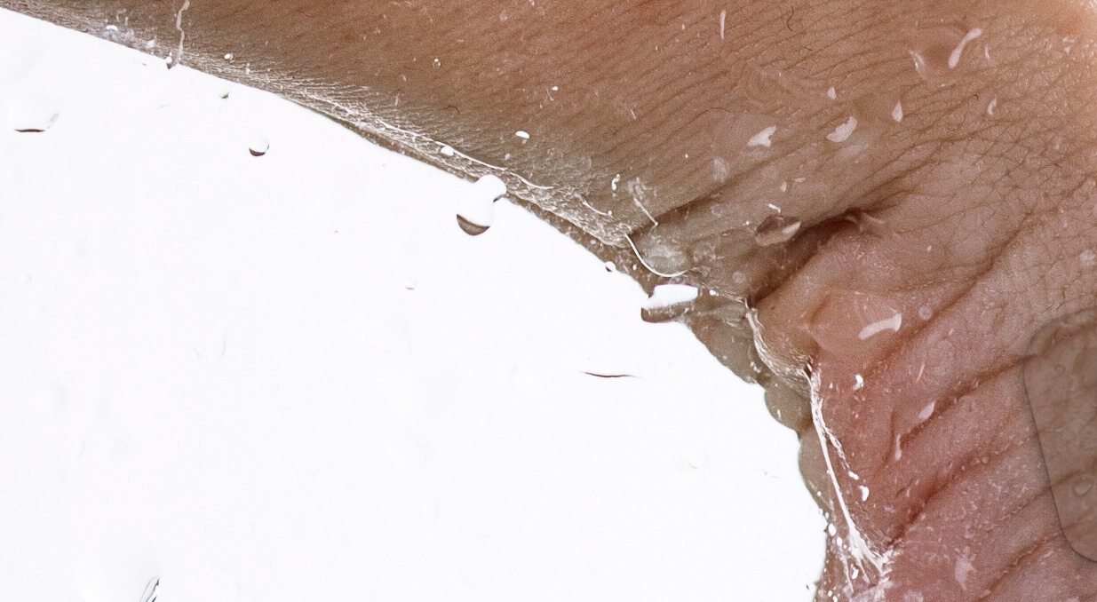 Demonstration of waterproof patch - hand reaching into water