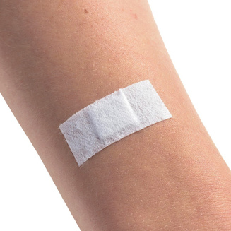 Image of “Injection” injection plasters (white) being used on skin