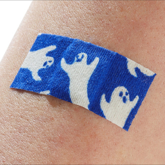 Injection color Spooky injection plasters with glow-in-the-dark ghost designs being used on skin