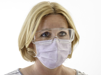 Image of face with mask and safety goggles as example of use of safety goggles/”over the glass” safety goggles
