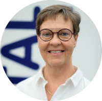 Photo of our employee Christiane Paschke against a neutral background